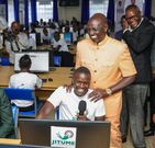 President William Ruto with a Remotasks user Brian Kipchumba at Kaiboi National Polytechnic