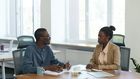 Man and woman having a conversation at the office [Image Credit: Edmond Dantès]