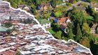 A collage of a slum and an affluent neighbourhoods