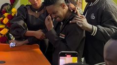 Screenshot of Eric Omondi being comforted by wife Lynne Njihia during memorial service of his late brother Fred Omondi on June 28, 2024