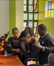 Screenshot of Eric Omondi being comforted by wife Lynne Njihia during memorial service of his late brother Fred Omondi on June 28, 2024