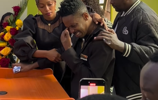 Screenshot of Eric Omondi being comforted by wife Lynne Njihia during memorial service of his late brother Fred Omondi on June 28, 2024