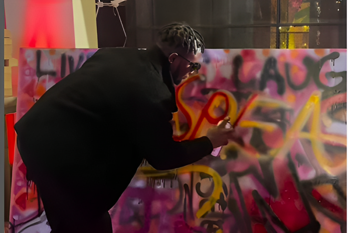 Guest participates in Kenya's most collaborative art piece, sponsored by I&M Bank at the Pulse Influencer Awards 2023