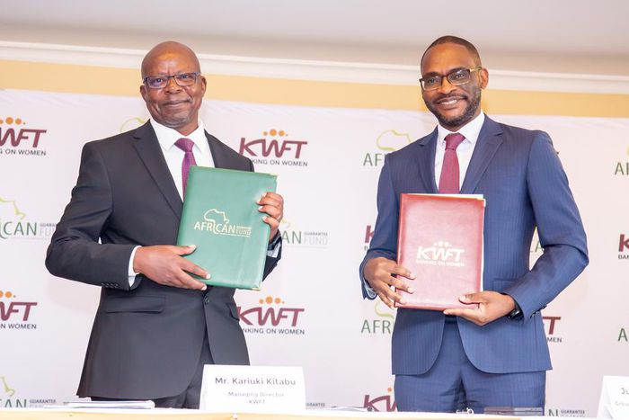 KWFT MD Kariuki Kitabu with AGF Group CEO Jules Ngankam after signing a risk-sharing partnership agreement in Nairobi on May 6, 2024