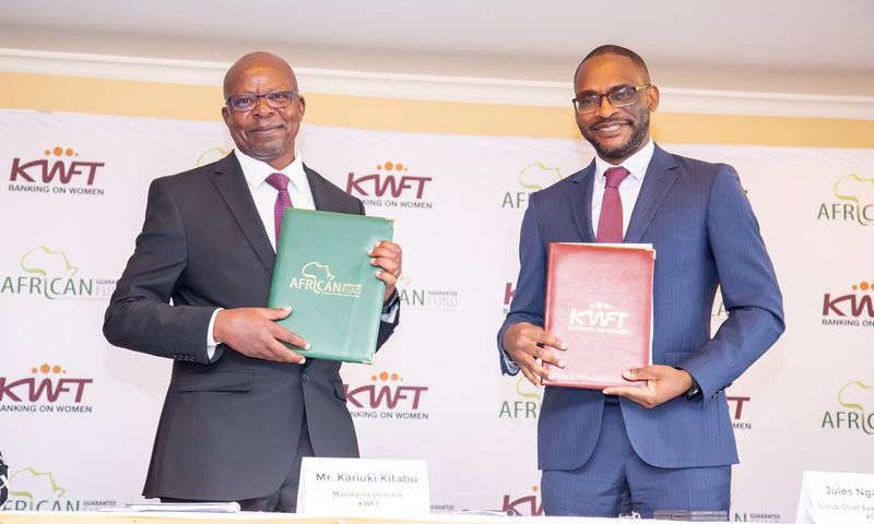 KWFT MD Kariuki Kitabu with AGF Group CEO Jules Ngankam after signing a risk-sharing partnership agreement in Nairobi on May 6, 2024