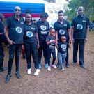 Akuku Danger and his family members lay their sister to rest on August 14, 2023