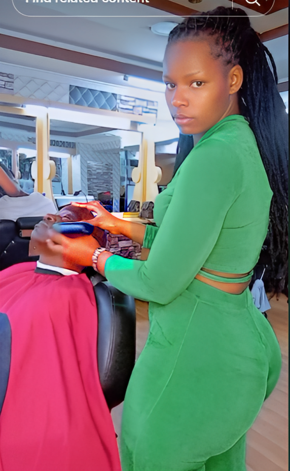 Grace Anne aka Barber Queen working on a client.