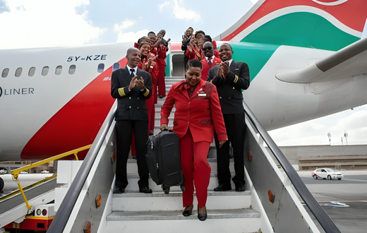 Retired KQ staffer Alice Waweru alights from a KQ plane on her last day of working after serving the company for 38 years.