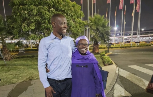 Stephen Munyakho embraced by his mother at the Jomo Kenyatta International Airport when he arrived from Saudi Arabia