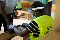 An IEBC official carries out voter registration