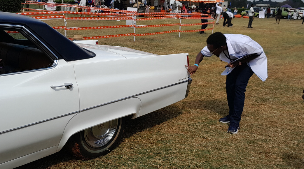 The vehicle's exterior is examined meticulously for signs of wear or damage
