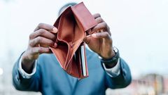 A person showing their wallet