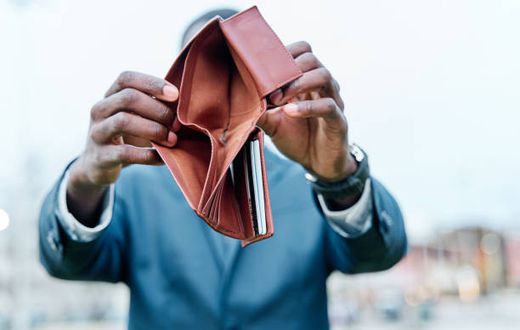 A person showing their wallet
