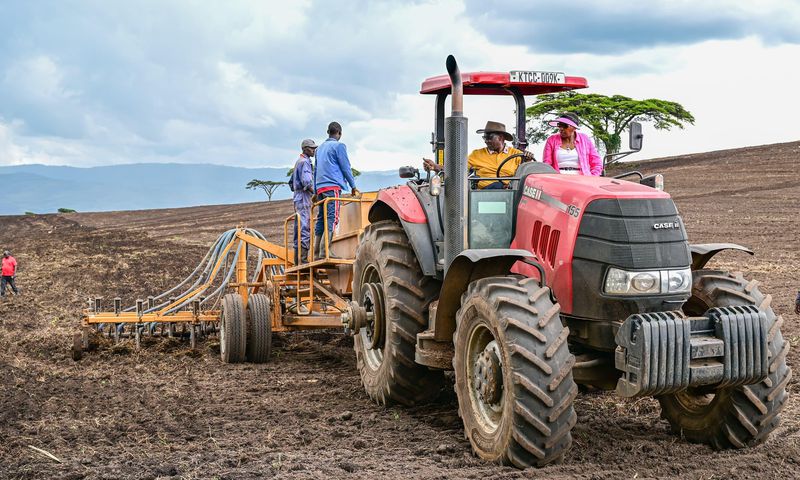 President William Ruto driving a tractor while preparing land for the planting season