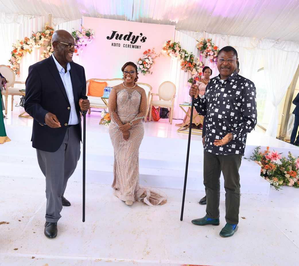 National Assembly Speaker Moses Wetangula with Court of Appeal judge Aggrey Muchelule  and his fife Judy Kerich pose for a photo during the couple's colourful traditional wedding