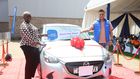 Winnie Dorah, the grand prize winner of a brand-new Mazda Demio in TECNO Kenya & Christmas Fiesta campaign, receives the car keys from Scott Liu, TECNO Kenya Country Manager, during the official handover ceremony at Garden City Mall, Nairobi.