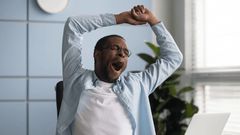 A man tired in the office depicting Ergophobia