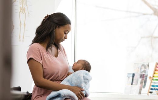 A mother holding her child