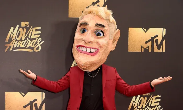 Singer Mike Posner in a mask